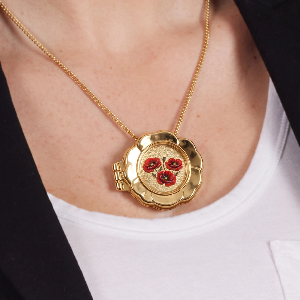 A woman wearing the Forever Remembrance Coin Locket Brooch on a necklace