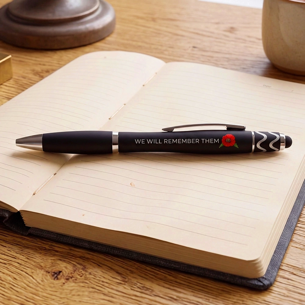 Forever Remember Stylus Pen placed on top of an open notebook in a study